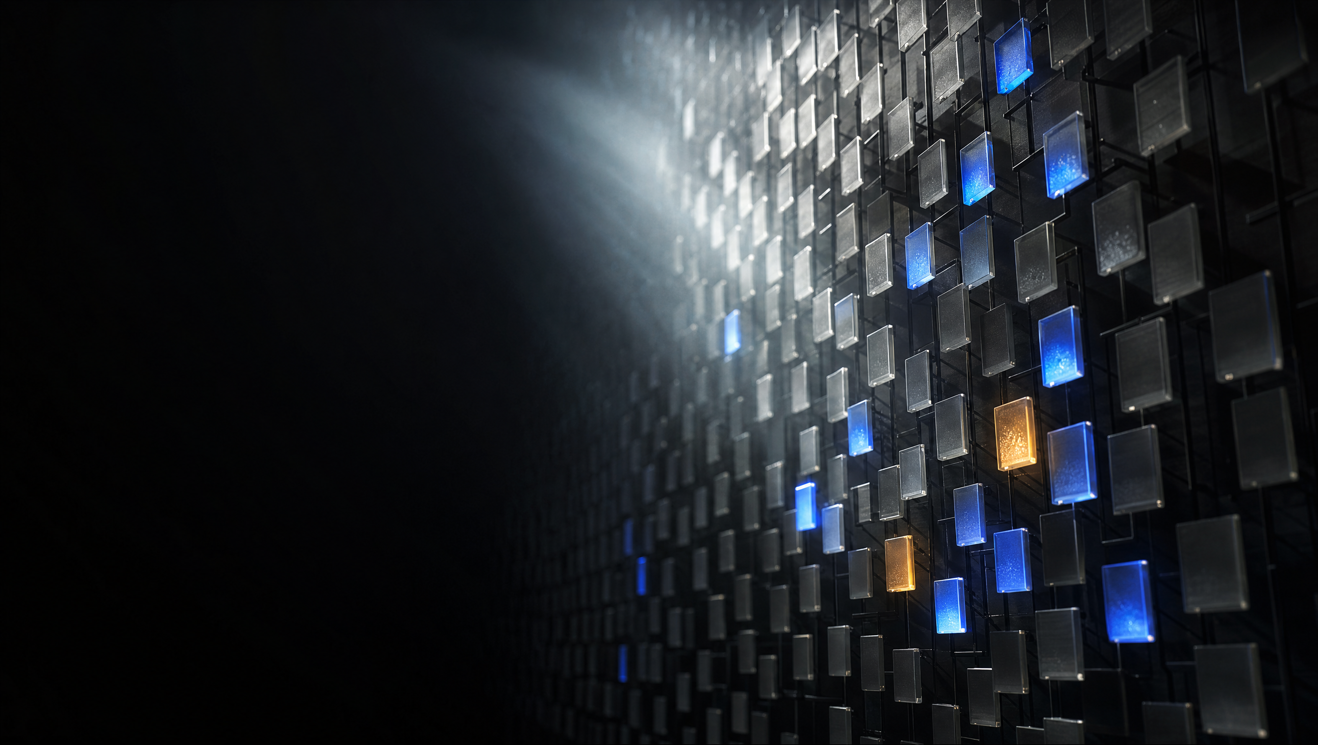 A dark wall of tiles with a sparse few glowing blue and amber: sparse attention keeping a handful of blocks and ignoring the rest.